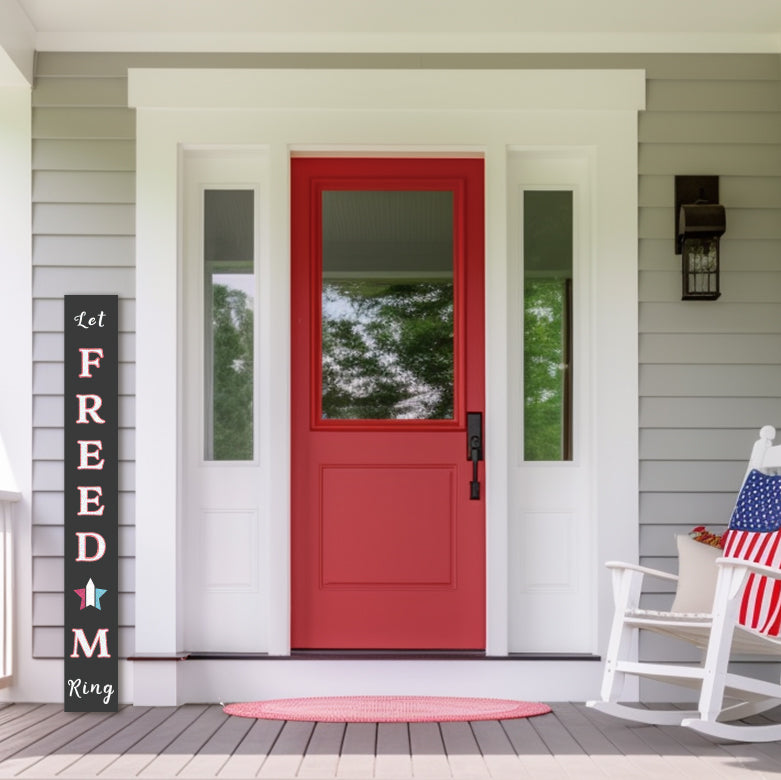 4th of July welcome sign &#39;Let Freedom Ring&#39; DIY sign crafted with magnetic letter stencils and chalk markers on a large outdoor chalkboard, placed next to red front door