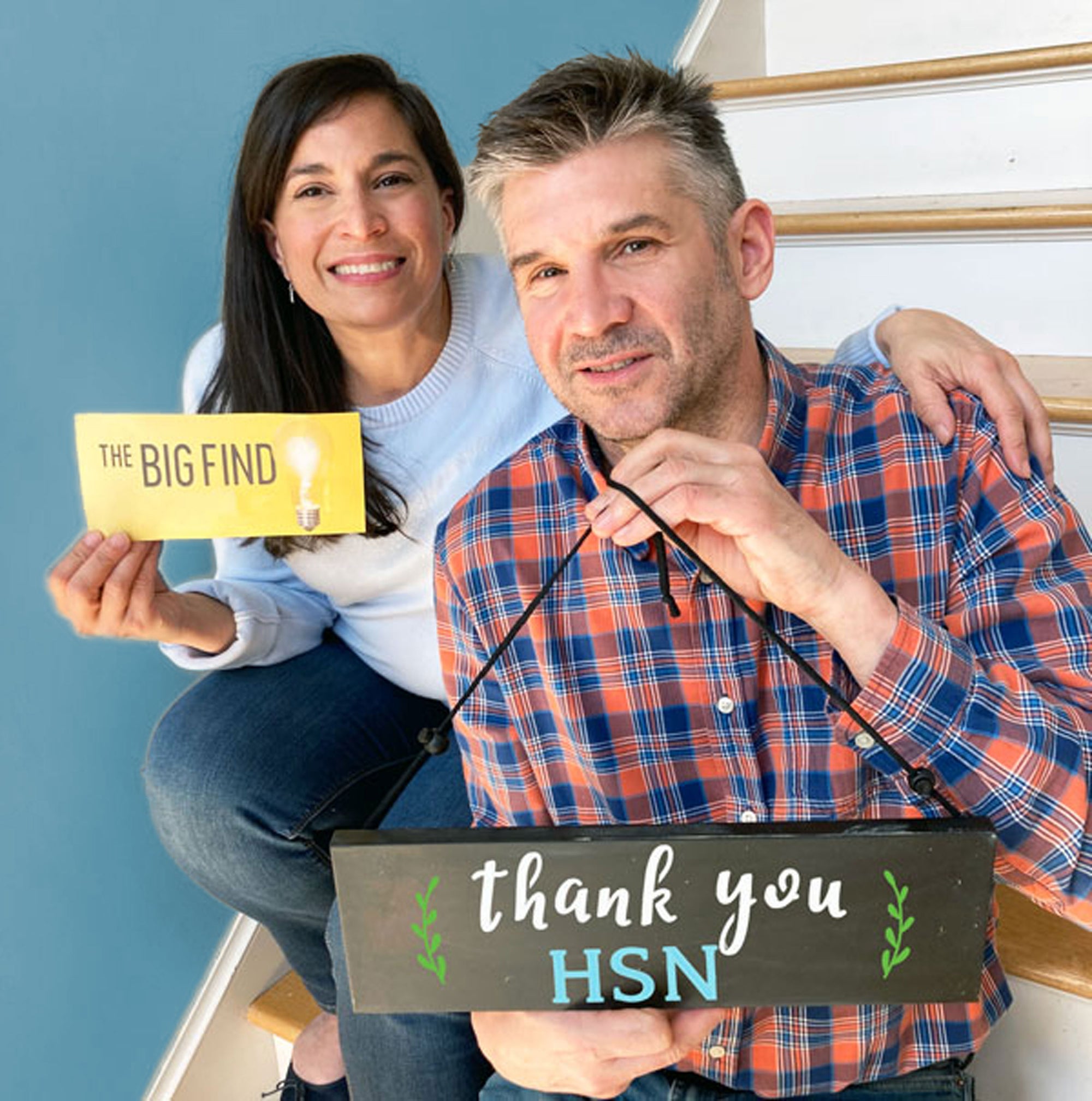 Karen and the Jeff, founders of Plata Chalkboards holding QVC Big Find winning ticket and a hanging chalkboard stenciled 'thank you HSN' crafted with magnetic chalkboard stencils