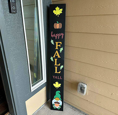 DIY fall sign 'HAPPY FALL Y'ALL' stenciled on an outdoor chalkboard sign with colorful autumn leaves, pumpkin and gnome, crafted using Plata Chalkboards porch chalk board, large letter stencils, gnome stencil and fall stencils to create a fall welcome sign