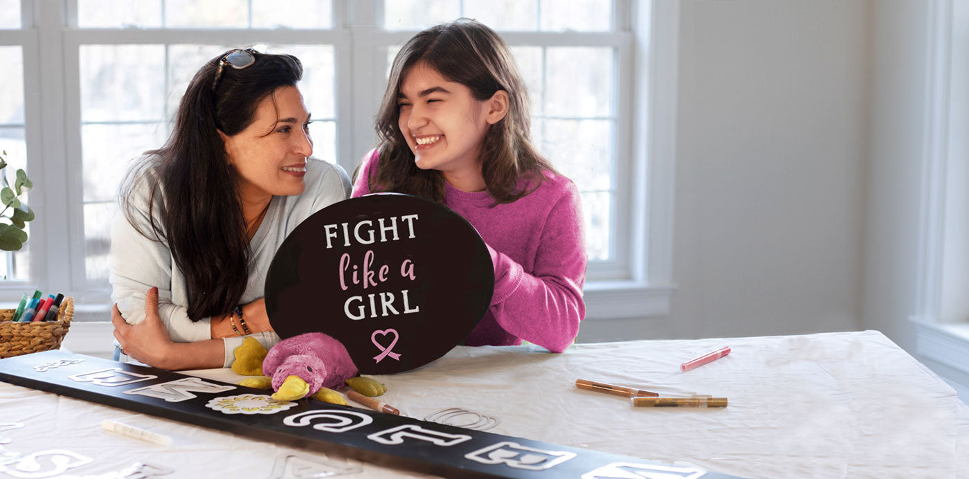 Mother and Daughter with a "Fight Like a Girl" Breast Cancer Chalkboard Sign made with chalkboard lettering stencils
