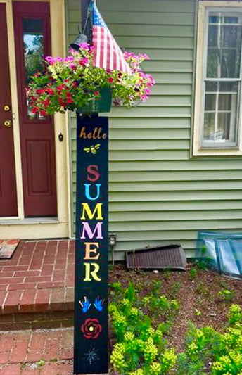 Hello summer DIY welcome sign, made with outdoor chalkboard, letter stencils painted in bright colors for summer chalkboard art