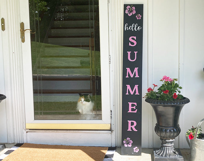 Hello Summer handmade welcome sign, crafted with tropical flowers and large letter stencils colored pink with chalk markers