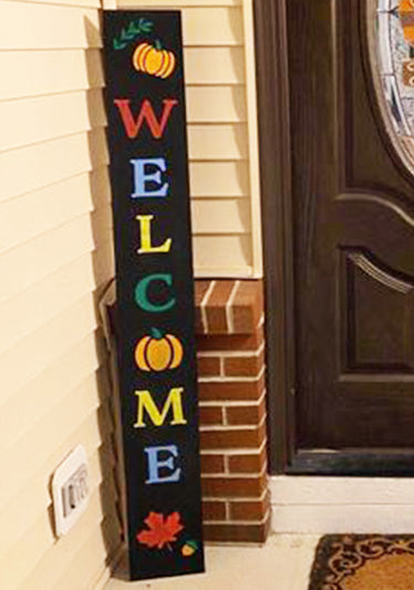 "Welcome" Personalized entryway welcome sign made with DIY sign kit of a large chalkboard, large letter stencils, autumn stencils painted in colorful colors	