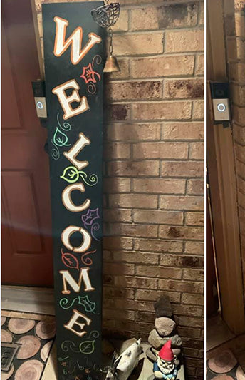 "Welcome" DIY fall welcome sign made with large vertical chalkboard, welcome letter stencils and painting pens. The stenciled letters are alternately placed off-kilter to create a whimsical welcome sign