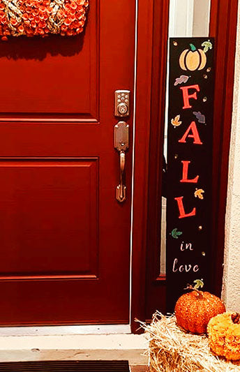 "Fall in Love" porch sign chalkboard crafted using magnetic capital letter stencils and cursive letter stencils to create a custom door sign. 