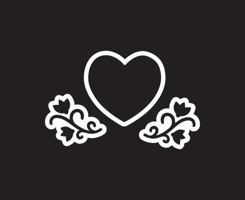 A Valentines Day chalkboard design of a heart chalkboard stencil surrounded by two flowering vine magnetic chalkboard stencils found in our Easter stencil set