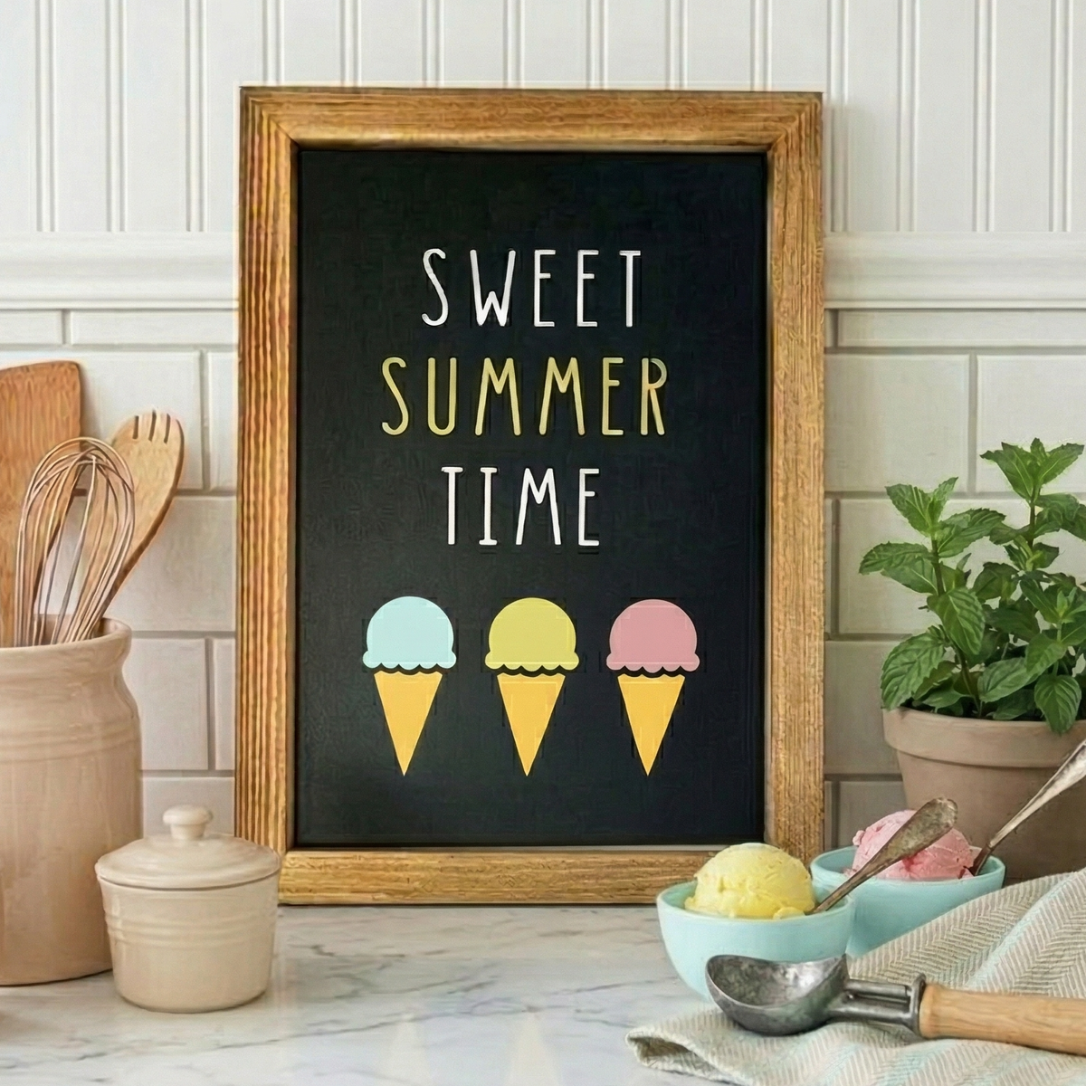 Framed print with 'Sweet Summer Time' text and ice cream cone illustrations in a kitchen setting.