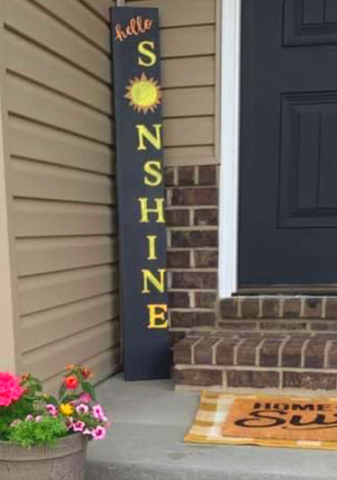 large chalkboard welcome sign with 'Hello Sunshine' with yellow letters and sun drawing made with magnetic letter stencils for easy summer chalkboard art