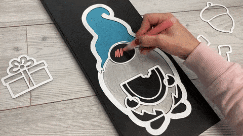 How to mix paint colors to make custom colors by adding two or more paint colors to the board, mixing together with the pen tip and then cleaning pen tip on a napkin