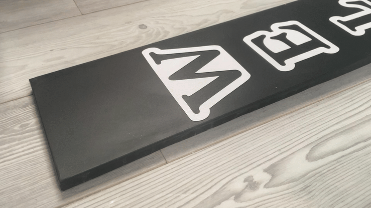 Gif of painting letter stencils to craft a welcome sign using paint pens and magnetic chalkboard stencils