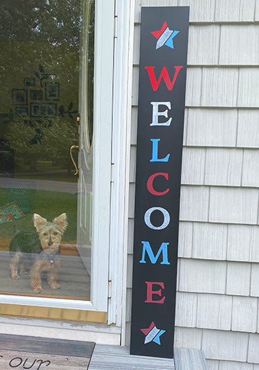 outdoor blackboard with 'welcome' in red, white & blue letters crafted with Porch Welcome Sign Craft Kit for DIY porch decorations