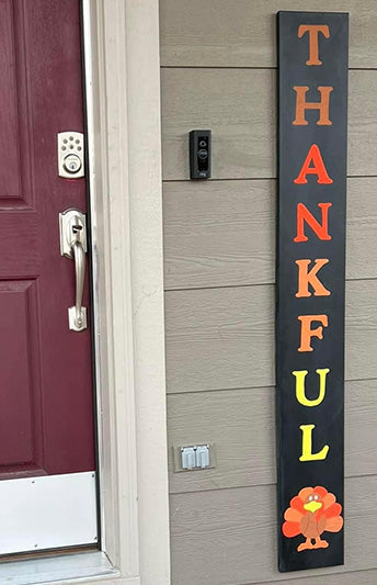 "Thankful" Colorful Thanksgiving Welcome Sign Chalkboard made by painting vertical letter stencils and adding a chalk art turkey