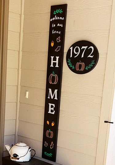 "Welcome to Our Home" Front Porch Sign made with large chalkboard, letter stencils, pumpkin stencils and oak leaf stencils to create a personalized outdoor welcome sign