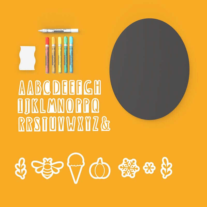 A display of everything included with Plata oval chalkboard sign craft kit- 11" x 14" oval chalkboard, alphabet of magnetic letter stencils, seasonal design stencils (bee, ice cream cone, pumpkin, snowflake stencils), 6 chalk markers and chalkboard eraser for easy DIY signs