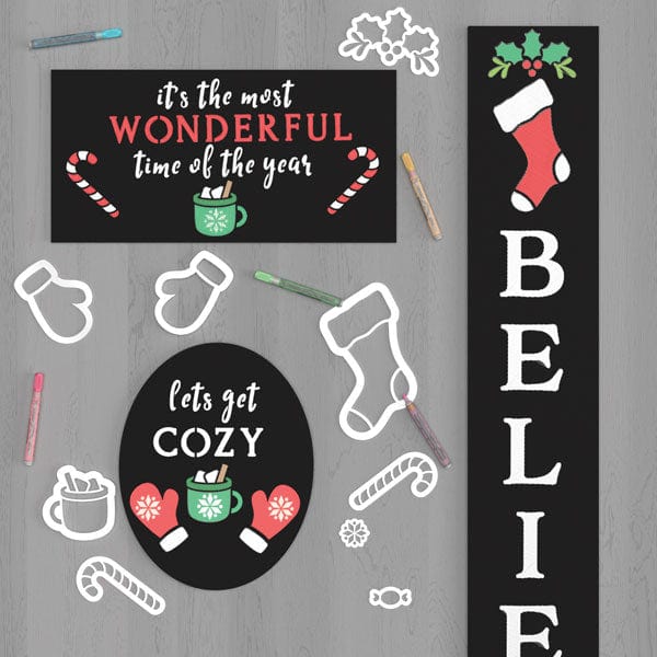9 Magnetic Christmas Chalkboard Stencils - a Christmas stocking stencil, 2 mitten stencils, a holly stencil, 2 candy cane stencils, a hard candy stencil, a star stencil and cocoa mug stencil to create a DIY chalk board signs