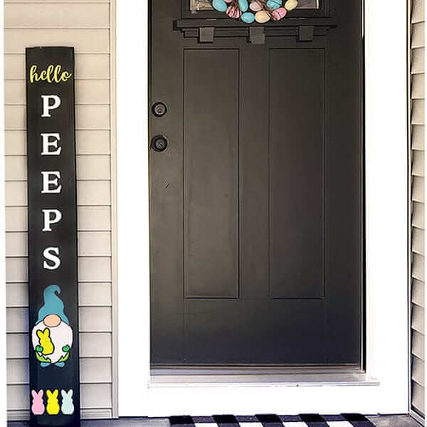 Hello Peeps large vertical Easter porch sign chalkboard with cute gnome holding peep bunny. Easter sign crafted with Plata Chalkboards DIY Sign Kit using large chalkboard, stencil letters, painting pens and Plata gnome stencils for chalkboards.