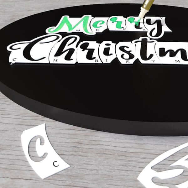 How to create beautiful brush font calligraphy with magnetic letter stencils. Cursive letter stencils slide together for perfect chalk lettering. Capital letter cursive stencils and lowercase cursive letters are placed together to craft Merry Christmas chalkboard sign to trace with chalk pens